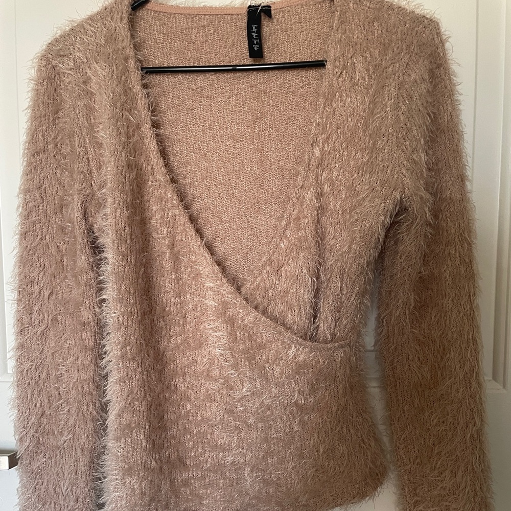 Never worn fuzzy cross front sweater.